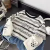 Camiseta de manga larga para niño, nueva colección de otoño 2026, top a rayas de corte holgado para niños, estilo de dos piezas, camiseta interior para bebé, ropa para niños