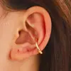 Venta caliente transfronteriza, pendientes de clip de oreja de aleación trenzada, estilo de diseño temperamento, sin perforaciones, pendientes simples al por mayor