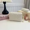 Hilo de bordar de comercio exterior bolsa de aseo de viaje para maquillaje 2026 hilo de bordar patrón de diamantes gran capacidad de viaje portátil bolsa de almacenamiento de mano