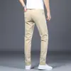 Pantalones casuales para hombre, nuevos pantalones tipo cigarrillo ajustados de negocios color caqui para primavera y otoño, pantalones largos elásticos para hombre, versátiles de largo nueve puntos