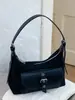 Nuevo bolso de hombro de color liso de alta moda para principios de otoño de 2026, bolso de hombro de nicho moderno y elegante para el trabajo y los desplazamientos, bolso cruzado