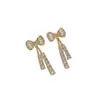 Pendientes de botón elegantes, lujosos y sofisticados con lazo de pedrería brillante, estilo coreano, modernos, versátiles, exquisitos, adecuados para estudiantes, pendientes de botón para mujer