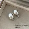Aretes de bola de trefilado de alambre aretes de bola aretes de bola redonda de metal estilo simple Joker aretes de bola redonda aretes de lujo ligero alta sensación aretes europeos y americanos Yiwu al por mayor