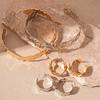 Juego de 2 piezas Aretes geométricos de círculo metálico exagerado Collar distintivo de temperamento europeo y americano avanzado para clavícula para mujer