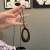 Estilo Harajuku ~ Collar con Colgante Ovalado Cortado en Cuerda de Cuero Negro para Mujer 2025 Nuevo Diseño de Nicho Cadena para Suéter Estilo Étnico