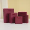Bolsa de mano para cosméticos de alta gama bolsa para tienda de ropa color vino tinto champán bolsa de regalo bolsa de papel para joyería venta al por mayor