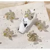 Artistas de uñas de moda joyería de circonita flor giratoria molino de viento tridimensional súper brillante cristal de circonita mariposa decoración de uñas fabricantes