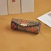 Estuche de regalo portátil estilo chino para lápiz labial, sencillo y elegante, con espejo, plegable y a prueba de polvo.