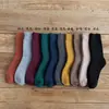 Calcetines de rizo para hombre y mujer calcetines de invierno de tubo grueso calcetines de lana de anillo calcetines de mujer color liso calcetines de toalla cálidos al por mayor
