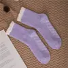 Calcetines de Piso de Invierno de Coral Fleece Retorcido de 7 Colores para Mujer de Amazon Transfronterizo al por Mayor