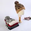 Nuevo gorro de punto de invierno al por mayor versión coreana del gorro de lana de leopardo bola directa cálido grueso en stock