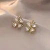 Pendientes de concha con borlas frescos y elegantes, pendientes con sentido de diseño para mujer, nuevos pendientes de botón de primavera y verano, venta al por mayor