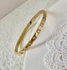 Pulsera de Zirconio CNC de Alta Calidad de Venta Caliente Transfronteriza, Color Acero Oro de 18K, Pulsera de Marca Grande, Resistente al Agua, No se Cae