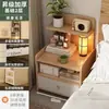 Mesita de noche Dormitorio Hogar Gabinete de almacenamiento Moderno simple Gabinete de almacenamiento elevado Pequeño simple Estante de almacenamiento multicapa Librero
