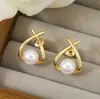 Pendientes Pequeños Luo Chen de Venta Caliente Transfronteriza, Incrustación Cruzada de Perlas Artificiales, Simples, Modernos, Exquisitos, Versátiles Pendientes de Botón para Mujer