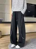 Calça Casual Reta Solta Desconstruída com Corte Curvo Outono Nova Sweatpants High Street para Homens com Costura Visível Tendência 2026 Estilo Americano Color Block