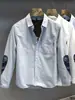 Camisa blanca de otoño retro a la moda con retazos de cachemir estilo Hong Kong estilo japonés camisa fresca para hombre de manga larga