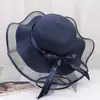 Nuevo Sombrero de Paja para Mujer Verano Viaje Sombrilla Sombrero Playa Mar Protector Solar Sombrero Estilo Coreano Ala Ancha Moño Anti-UV