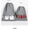 Bolsa de almacenamiento y acabado para zapatos de viaje coreanos, engrosada, impermeable, multifuncional, portátil, bolsa para zapatos, bolsa antipolvo para zapatos y botas de tela no tejida