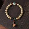 Hainan Semilla Dorada Cadena de Mano Grasa de Pollo Estrella Amarilla Luna Bodhi Madera de Durazno Flor de Loto Hombres y Mujeres Juego Cultural Pulsera de Cuentas Budistas Fabricante Mayorista