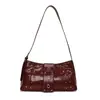 Bolso de mano de diseño exclusivo para mujer 2025 Nuevo Retro Remache Moda Elegante Moderno Bolso de un solo hombro para la axila