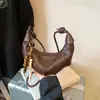 Bolso pequeño plisado con forma de cuerno transfronterizo para mujer, nuevo bolso casual versátil de moda otoño 2026, bolso de hombro y cruzado tipo dumpling