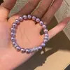 Pulsera de perlas con lazo de doble capa estilo vintage francés, diseño único y versátil, joyería de lujo ligero y de alta gama