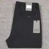 Nuevos pantalones casuales rectos de bolsillo inclinado para hombre de lujo importado, estilo simple europeo y americano, pantalones negros de negocios para hombre