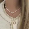 Collar de perlas de doble capa estilo retro francés para mujer, ligero, lujoso, de alta gama, con cadena para el cuello.