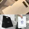 Bolsa de Regalo Personalizada Bolsa de Papel de Mano Personalizada Bolsa de Compras para Tienda de Ropa Cosméticos Bolso de Mano Impresión de Logo Personalizada