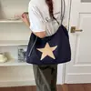 Bolso tote casual versátil para el trabajo y el uso diario, nuevo modelo 2026, gran capacidad, diseño simple, bolso de hombro para commute de mujer con estampado de estrellas