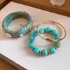 Pulsera Circular con Forma de Concha de Resina y Metal Chapado en Oro Ámbar, con un Toque de Lujo Ligero y de Alta Gama, Accesorio de Mano Simple y de Moda