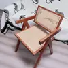 Silla de comedor de madera maciza para uso doméstico, silla Chandigarh de estilo vintage con reposabrazos y respaldo, silla de ocio, popular en restaurantes en línea, silla tejida de ratán