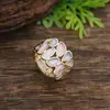 Anillo elástico geométrico hueco de pétalo de esmalte más vendido transfronterizo para mujer, anillo de flor versátil simple y de alta gama
