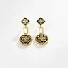 Pendientes de trébol de cuatro hojas del mismo estilo de la serie Wanxiang de la joyería de oro, pendientes y conjunto de collar de moda nicho de tendencia china exquisitos al por mayor