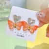 Pendientes Pin Heng para mujer, nuevos pendientes acrílicos con diseño de mariposa bronceada, elegantes, frescos y con explosiones, al por mayor.