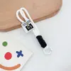 Chaveiro Corda Trançada de Nylon Cordão Mosquetão Masculino e Feminino Corda de Mão para Casal Pingente de Bolsa Chaveiro de Carro Popular