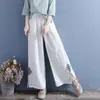 Pantalas Femininas de Sarja com Bordado Literário em Algodão e Linho Cintura Elástica Largas Afinando Harem Cor Sólida Casuais Pantalonas Cropped