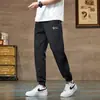 Calça Casual Fresca de Seda de Gelo Masculina Verão Novo Solta Respirável Calça de Perna Meninos Fina Mais Fácil de Combinar Calça Esportiva Nove Pontos