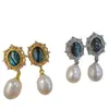 Nuevos pendientes de mujer de moda para comercio electrónico transfronterizo europeo y americano: perla natural, moda vintage popular, aretes creativos para dama