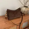Outono 2026 Nova Moda Retrô Bolsa de Ombro Único de Alto Valor Sensação Relaxada Nicho Bolsa de Mão/Axila para Trabalho e Deslocamento
