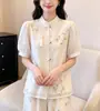 Nueva camisa tradicional de estilo chino con botones y bordado pesado para mujer, nuevo top blusa bordada de alta gama para el verano 2026