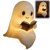 Novo produto transfronteiriço: Luz de noite fantasma de Halloween lendo, ornamento criativo de resina, decoração fofa para mesa, luz de noite ambiente