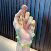 Lindo Colgante Llavero de Cristal con Cuentas de Flor Cadena Pequeña para Teléfono Cadena de Bolso Wholesale de Pequeños Productos de Yiwu
