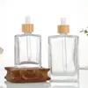 Botella dispensadora de aceite esencial de vidrio transparente, gotero de punta de plástico portátil, empaque de producto para el cuidado de la piel, botella vacía, botella de perfume portátil para viajes