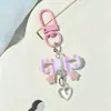 Lindo llavero con lazo hueco estampado, accesorio pequeño para DIY, decoración de bolso de moda y versátil, al por mayor