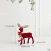 Decoración navideña transfronteriza: Adorno de reno aterciopelado color burdeos con lazo de purpurina, arreglo de decoración de escena de mesa de reno