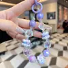 Cadena de Teléfono Móvil con Cuentas Láser Pintadas a Mano de Colores Creativos Llavero de Cristales de Moda Adornos Colgantes para Bolsos de Mano de Alta Gama