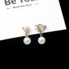 E179 Ventas Directas de Fábrica Yiwu Exquisitos Pendientes de Botón con Perla Incrustada de Pedrería Pendientes Creativos de Molinillo de Viento en Espiral Joyería al por Mayor