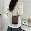 Moda de verano 2026 transfronteriza mini bolsa suave tejida versátil bolsa para teléfono para mujer bolso pequeño de hombro cruzado